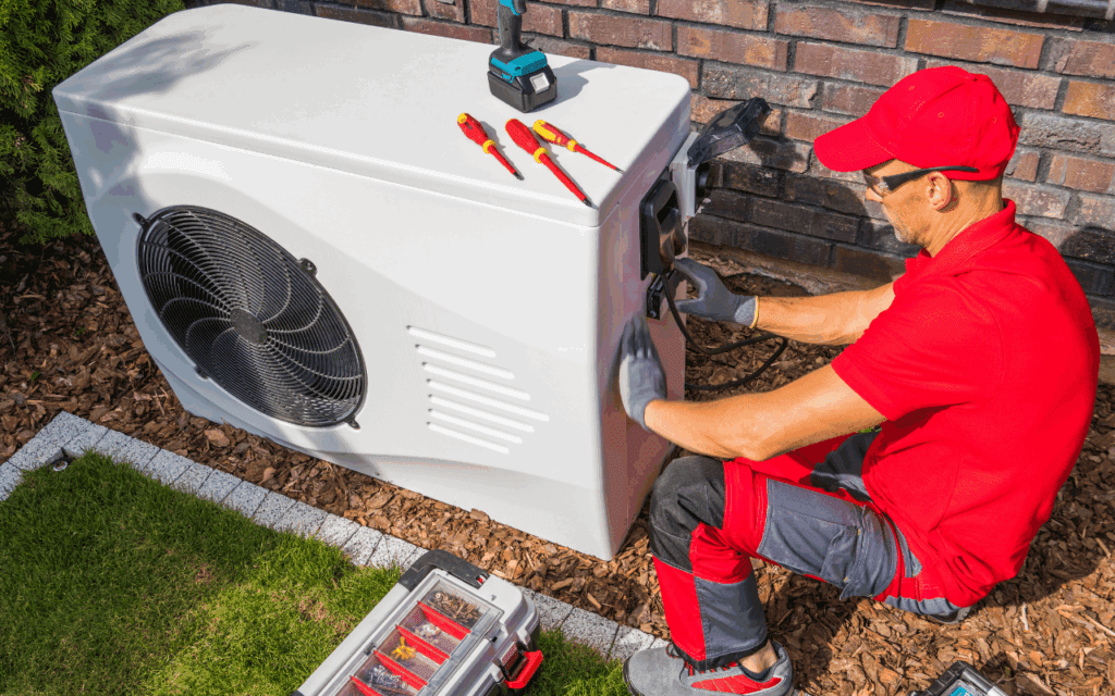 Technician working on outdoor unit.