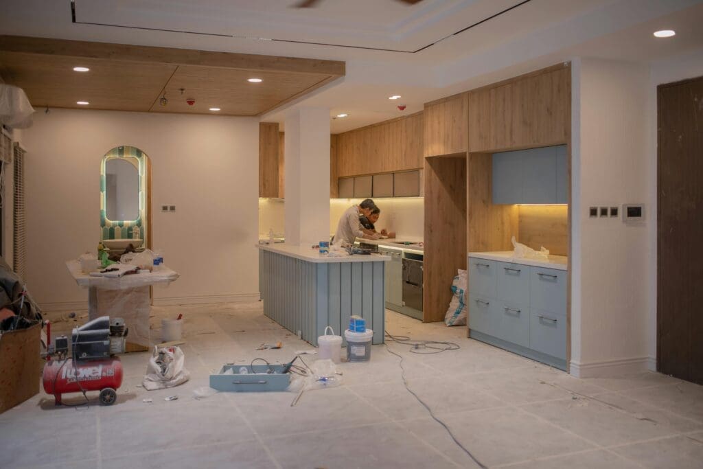 Kitchen renovation in progress, tools scattered.