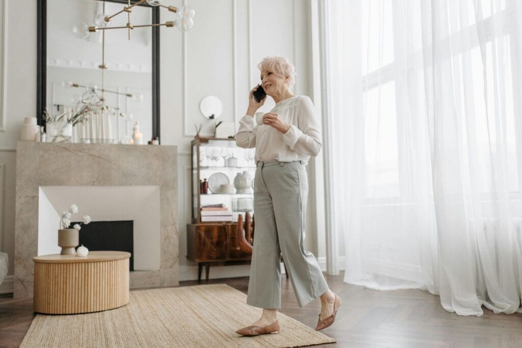 Person talking on phone indoors.