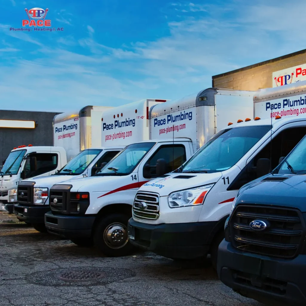 Fleet of plumbing service vehicles parked