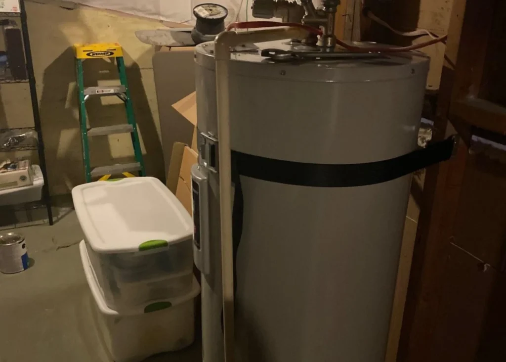 Water heater in a basement setting.
